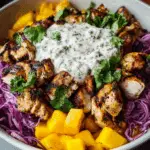 jerk chicken & mango slaw bowls with honey lime cream Recipe